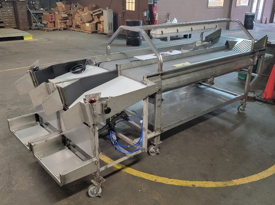 twin Boxing Chutes at the end of a repack inspection table