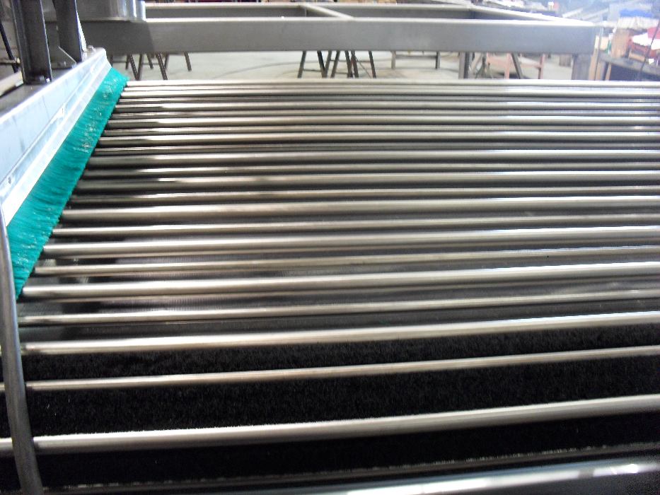 closeup of sizing rods with side-brush